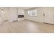 Bright living room features a modern electric fireplace and neutral flooring at 5780 W 5Th Ave, Lakewood, CO 80226