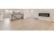 Open-concept living area features modern fireplace and hardwood floors at 5780 W 5Th Ave, Lakewood, CO 80226