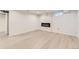 Finished basement with electric fireplace, recessed lighting, and light wood floors at 5780 W 5Th Ave, Lakewood, CO 80226