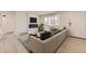 Bright living room with modern fireplace, sleek furniture, and hardwood floors at 5780 W 5Th Ave, Lakewood, CO 80226