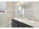 Bathroom featuring granite counters, dual sinks, new fixtures and a well lit mirror at 10659 Montecito Dr, Lone Tree, CO 80124