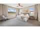 Bright bedroom with a scenic view, ceiling fan, and elegant furnishings for a serene retreat at 10659 Montecito Dr, Lone Tree, CO 80124