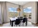 Bright dining area with natural light, stylish décor, and access to an outdoor patio at 10659 Montecito Dr, Lone Tree, CO 80124