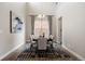 Elegant dining room featuring modern decor, a chandelier, and lots of natural light at 10659 Montecito Dr, Lone Tree, CO 80124