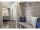 Entryway with a bench, coat hooks, and a view into the dining room at 10659 Montecito Dr, Lone Tree, CO 80124