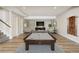 Basement game room with a pool table, TV, and seating, perfect for entertainment at 10659 Montecito Dr, Lone Tree, CO 80124