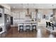 Bright kitchen featuring stainless steel appliances, island seating, and an adjacent dining area at 10659 Montecito Dr, Lone Tree, CO 80124