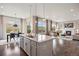 Bright kitchen with granite countertops, island seating, and an adjacent dining area at 10659 Montecito Dr, Lone Tree, CO 80124