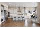 Spacious kitchen with stainless steel appliances, a large island, and hardwood floors at 10659 Montecito Dr, Lone Tree, CO 80124