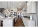 Modern kitchen featuring stainless steel appliances, granite countertops, and a large island at 10659 Montecito Dr, Lone Tree, CO 80124