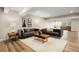 Spacious living room with stylish furniture, wood floors, and plenty of natural light at 10659 Montecito Dr, Lone Tree, CO 80124