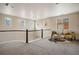 Upstairs loft featuring neutral colors, carpet, and a seating area at 10659 Montecito Dr, Lone Tree, CO 80124