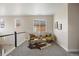 Upstairs loft featuring neutral walls, plush gray carpeting, and unique decor including yellow chairs at 10659 Montecito Dr, Lone Tree, CO 80124