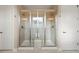 Elegant bathroom featuring a dual-head glass shower with a built-in bench at 10659 Montecito Dr, Lone Tree, CO 80124