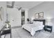 Comfortable bedroom with a modern rug, ensuite bath, and stylish decor at 2501 15Th St # 3F, Denver, CO 80211
