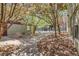 Landscaped courtyard with mature trees, hardscape, and access to the building at 2501 15Th St # 3F, Denver, CO 80211