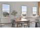Sunlit dining area with views, showcasing the seamless blend of modern design and comfortable living at 2501 15Th St # 3F, Denver, CO 80211
