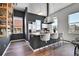 Bright kitchen featuring an island with bar seating, modern appliances, and ample natural light for a chic space at 2501 15Th St # 3F, Denver, CO 80211