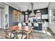 Modern kitchen with a central island, stainless steel appliances, and open shelving for an inviting culinary space at 2501 15Th St # 3F, Denver, CO 80211