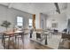 Spacious living area with ample natural light, window seating, and stylish decor, creating a welcoming ambiance at 2501 15Th St # 3F, Denver, CO 80211