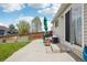 Backyard showcasing the patio, lawn and the glass doors to the home at 21961 E Crestline Pl, Aurora, CO 80015