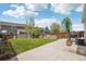Backyard view of an outdoor patio and grilling area and a plush lawn at 21961 E Crestline Pl, Aurora, CO 80015
