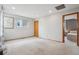 Bright bedroom featuring carpeted floors and trim, natural light, and neutral colors at 21961 E Crestline Pl, Aurora, CO 80015