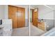 bedroom featuring neutral paint, closet space and playful artwork on a dresser at 21961 E Crestline Pl, Aurora, CO 80015