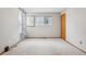 Bedroom with two windows and hardwood trim offering a bright open space at 21961 E Crestline Pl, Aurora, CO 80015