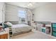 Bright bedroom with a house-shaped bed frame and neutral paint color at 21961 E Crestline Pl, Aurora, CO 80015
