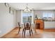 Cozy dining area with hardwood floors, natural light, and classic decor at 21961 E Crestline Pl, Aurora, CO 80015