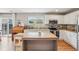 Well-appointed kitchen with granite countertops, modern appliances, and a functional island, bathed in natural light at 21961 E Crestline Pl, Aurora, CO 80015
