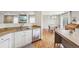 Modern kitchen features stainless steel appliances, granite countertops, and opens to the dining area at 21961 E Crestline Pl, Aurora, CO 80015