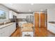 Spacious kitchen featuring an island, granite countertops, and stainless steel appliances, perfect for cooking and entertaining at 21961 E Crestline Pl, Aurora, CO 80015