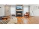 Inviting living room with fireplace, hardwood floors, and natural light at 21961 E Crestline Pl, Aurora, CO 80015