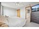 Calm main bedroom featuring a neutral color palette, carpet flooring, and an open doorway leading to additional rooms at 21961 E Crestline Pl, Aurora, CO 80015