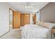 This is a well-lit primary bedroom with an ensuite bathroom and ample closet space at 21961 E Crestline Pl, Aurora, CO 80015