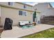 Outdoor patio with seating, grill, and sliding door to the home at 21961 E Crestline Pl, Aurora, CO 80015