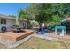 Entertaining backyard with deck, grill, play area and lush tree, perfect for relaxation and Gathering fun at 3253 S Kalispell St, Aurora, CO 80013