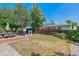 Spacious backyard with a wooden deck, mature trees, and a play area provides space for outdoor enjoyment at 3253 S Kalispell St, Aurora, CO 80013