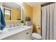 Bright bathroom with a white marble vanity, lavender accents, and elegant fixtures at 3253 S Kalispell St, Aurora, CO 80013
