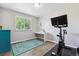 Bedroom with bright natural light, laminate floors and space for work and exercise at 3253 S Kalispell St, Aurora, CO 80013