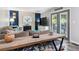 Stylish living room featuring a cozy couch, a modern fireplace, a wooden table, and sliding glass doors at 3253 S Kalispell St, Aurora, CO 80013