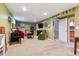 Spacious living room with neutral carpet and green walls, offering a versatile living space at 3253 S Kalispell St, Aurora, CO 80013