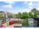 Outdoor balcony with seating area and treetop views at 7240 W Custer Ave # 205, Lakewood, CO 80226