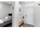 Small bedroom with entry featuring a bench and coat hooks at 7240 W Custer Ave # 205, Lakewood, CO 80226