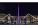 Night view of Century movie theatre, illuminated signage, and festive string lights at 7240 W Custer Ave # 205, Lakewood, CO 80226
