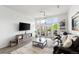 Bright living room, featuring hardwood floors and access to a balcony at 7240 W Custer Ave # 205, Lakewood, CO 80226