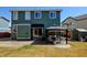 Green backyard featuring a patio with an outdoor seating area covered by a stylish gazebo at 10041 Dillon Cir, Commerce City, CO 80022