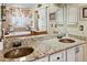 Bathroom area showing vanity with dual sinks, large mirror, and lots of counter space at 10041 Dillon Cir, Commerce City, CO 80022